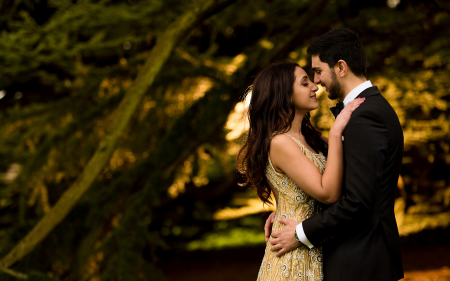 Pre-wedding photoshoot of a couple at Prathamesh Resort, capturing romantic moments with scenic riverside views.