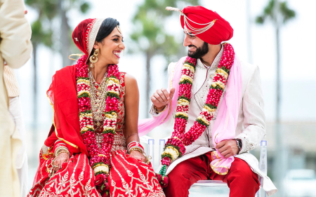 Stunning couple in a wedding photoshoot with picturesque riverside views at Prathamesh Resort.