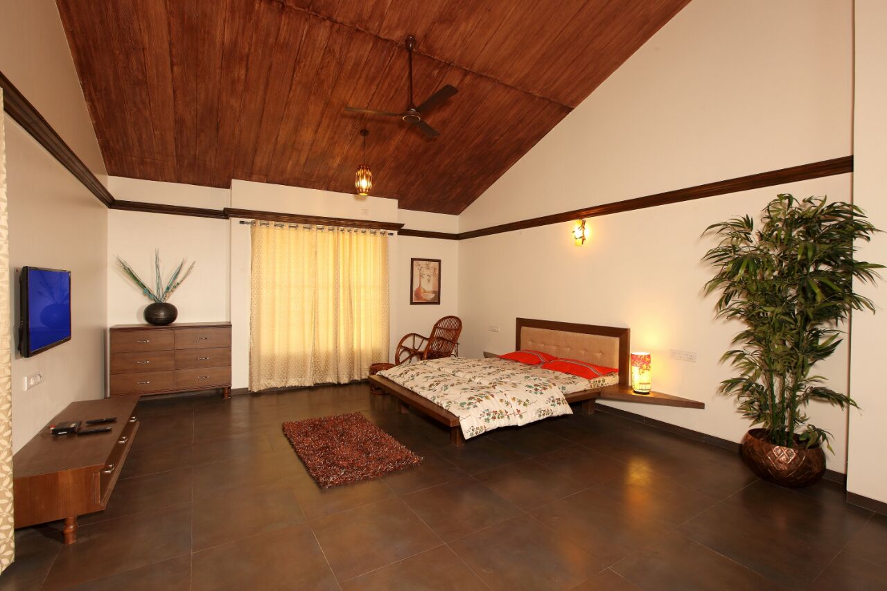 Cozy and luxurious room with a comfortable bed at Prathamesh Resort.