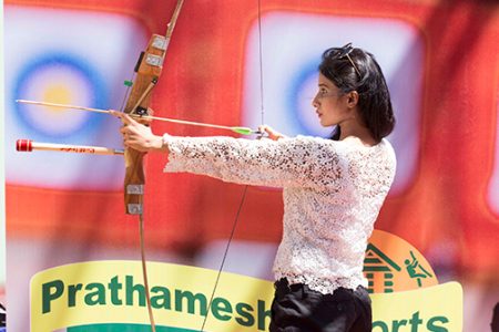 Guest practicing archery at Prathamesh Resort, a fun and engaging sports activity near Pune.